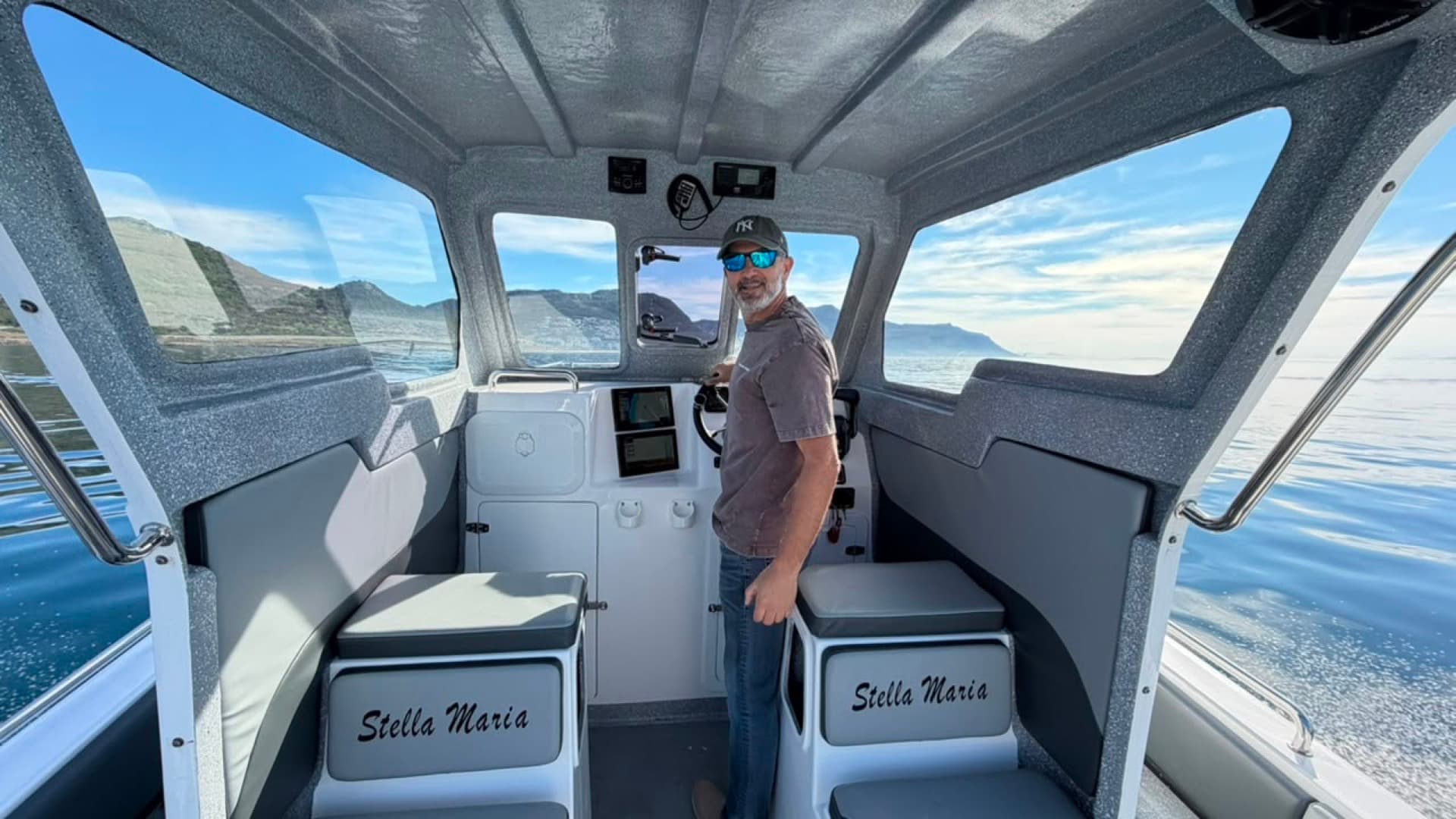 At the helm of the Stella Maria